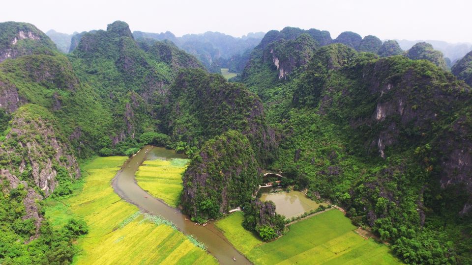 From Hanoi: 2-Day Ninh Binh Tour with Accommodation & Meals - Cycling through rice paddies and limestone with a real village stop