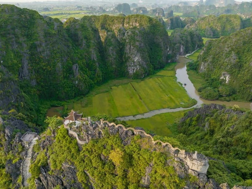 From Hanoi: Hoa Lu, Tam Coc, Mua Cave & Cycling in Ninh Binh - Tam Coc Boat Trip: Rice Fields, Limestone Caves, and the Real Timing