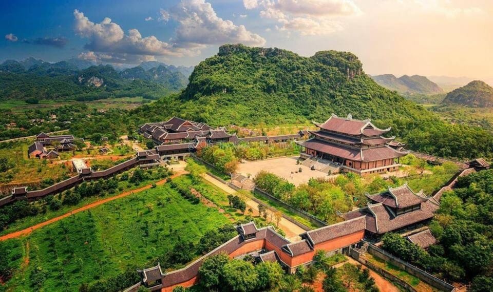From Hanoi: Ninh Binh & Bai Dinh & Trang An & Mua Caves Tour - Bai Dinh Pagoda: Golden Buddha statues and the mountainside calm