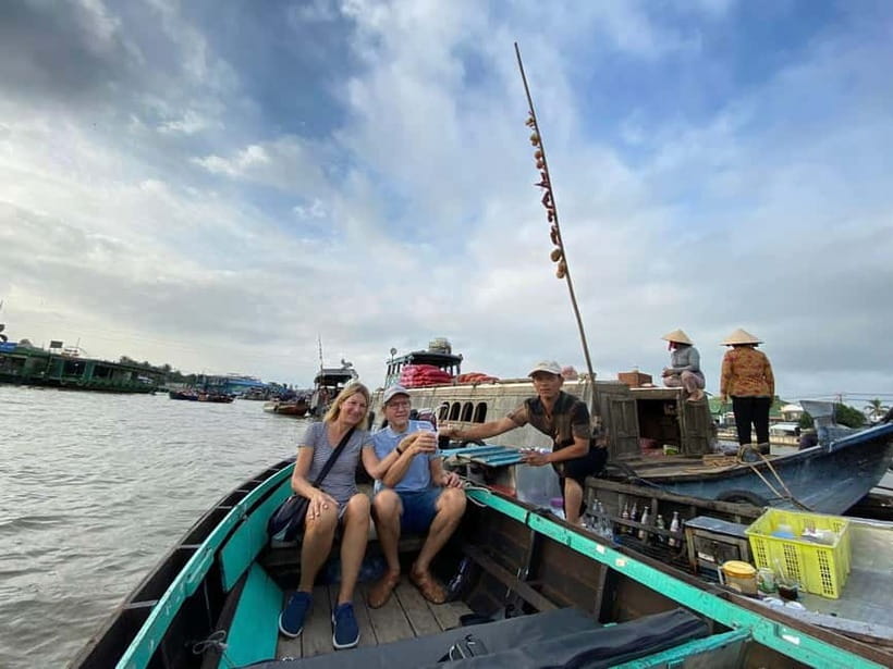 From HCMC: Cai Rang Floating Market & Mekong Delta Private - Cai Rang Floating Market: shopping, fishing returns, and boat-to-boat life